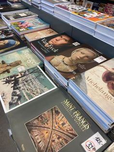 many books are on display in a book store