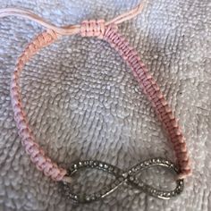 Never Worn Pink Adjustable Bracelet Jewelry, Adjustable Nickel-free Braided Bracelets, Casual Silver Infinity Jewelry, Handmade Adjustable Infinity Jewelry, Elegant Adjustable Pink Friendship Bracelets, Elegant Pink Braided Bracelets As Gift, Elegant Pink Braided Bracelet Gift, Trendy Adjustable Infinity Bracelet, Opal Cuff Bracelet