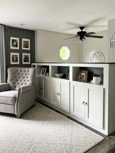 a living room filled with furniture and a ceiling fan