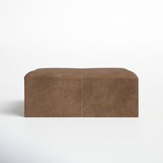 a brown box sitting on top of a white surface