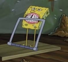 an animated spongebob character with his mouth open and tongue out, standing on a wooden platform