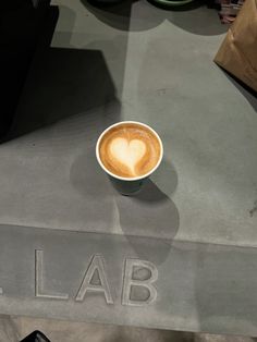 a cappuccino with the word lab written on it