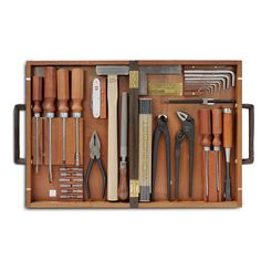 a wooden box filled with lots of tools