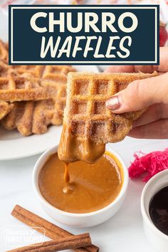 a person dipping some kind of sauce into waffles with cinnamon sticks on the side