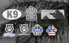 stickers on the side of a car with an american flag and dog paws