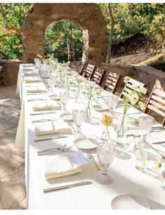 a long table is set up with place settings