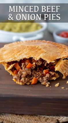 minced beef and onion pie on a cutting board