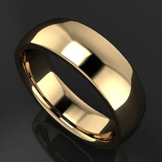 a gold wedding ring on a black background