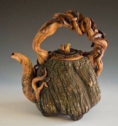 a teapot made out of tree bark