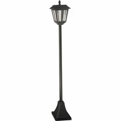 an outdoor lamp post with a light on it's top and the base is black