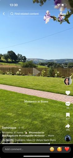 an image of someone taking a selfie on their cell phone in the yard with flowers