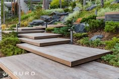 wooden steps lead up to the top of a hill