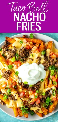 taco bell nacho fries on a plate with ranch dressing and sour cream in the middle