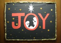 a sign that says joy on the side of a wall with stars and a baby in it