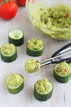 cucumber slices cut in half and topped with guacamole