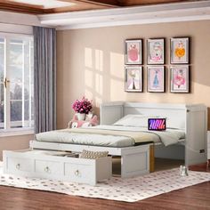 a bed room with a neatly made bed next to a dresser and drawers on the floor