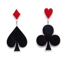 the earrings are made out of black and red playing card suits with hearts on them