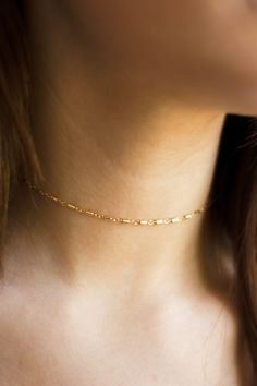 Looks great alone or layered! A go- to unique chain for stacking! Shower proof, swim proof, sweat proof! 14k gold filled and easily adjustable. Comes wrapped ready to gift! -- 14K GOLD FILLED NECKLACE 2'' EXTENDER SPRING CLASP CLOSURE CHOOSE YOUR LENGTH -- --PROCESSING TIMES-- Item is custom made to order, please allow 4 - 12 business days to ship. Comes wrapped ready to gift! --CUSTOMIZATION-- Want to add a pendant? Message me for options and a custom listing. --QUALITY IS EVERYTHING-- You're i Adjustable Gold Chain Choker As Gift, Minimalist Choker With Delicate Link Chain, Minimalist Link Choker With Delicate Chain, Minimalist Choker With Delicate Chain Link, Dainty Gold Chain Choker Jewelry, Dainty Cable Chain Choker Jewelry, Gift Link Choker With Adjustable Chain, Gift Choker With Adjustable Link Chain, Dainty Cable Chain Choker