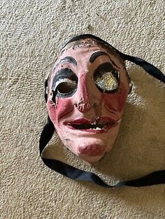 This is a very old paper mask, it is marked Germany. The mask has several rips and tears. Please take a look and let me know what you think! Paper Mask, Halloween Paper, The Mask, Old Paper, What You Think, Vintage Antiques, You Think, Thinking Of You, Take A