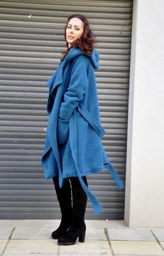 "Hooded Wool Coat, Winter Wool Coat, Dark Blue Coat Turquoise coat. Autumn-winter loose coat. Wool hooded maxi coat. Oversize wool jacket. Handmade item. The coat has a viscose lining. Two pockets, warm hood. Black 100% wool, best quality wool coat . Casual and warm, cozy and very comfortable . You can wear it in winter in warmer days, and in autumn and winter. Model wearing size : SIZE S Color : Turquoise SIZE S (US 6, UK 10, Italian 40, French 38, German 36, Japan 7) bust: fits bust around 35. Oversized Winter Coat, Dark Blue Coat, Halloween Jacket, Hooded Wool Coat, Coat Plus Size, Poncho Coat, Loose Coat, Hooded Winter Coat, Wool Winter Coat