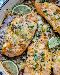 chicken enchilada in a skillet with limes and parmesan cheese