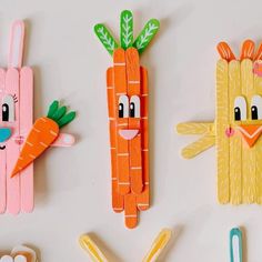 three paper carrots and one bunny made out of construction paper