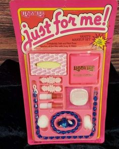 a pink toy set with beads, rings and bracelets in it's packaging