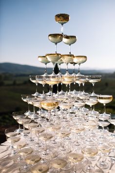 many wine glasses are stacked on top of each other in the shape of an upside down chandelier