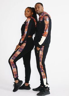 Style#AM4007BONK Take your leisure look to the next level with our Faraji joggers in black/orange navy kente. Made with the most comfortable french terry fabric, you'll want to wear these every day. African print side stripes add flair to these joggers, which can be perfectly paired with the Tumo zip-up hoodie. Shop the matching items here. Description: African print side stripe White color-blocked panel at pant leg Functional drawstring at the waist Gold drawstring details Rib knit at cuff 2 si Modern African Clothing, African Couple, Athleisure Joggers, Sporty Fashion, African Print Tops, African Outfits, Gym Apparel, Dresses African, Gold Paisley