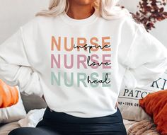 "⭐ PREMIUM QUALITY ⭐ Made in the USA! MORE SUPER CUTE SHIRTS, SWEATSHIRTS AND GIFT IDEAS AWAIT YOU ON OUR ETSY STORE 👉 https://www.etsy.com/shop/TheKersStore 📏 SIZING: Our sweatshirts typically run true to size but we always suggest ordering up a size if you want it to be slouchy and extra oversized, because honestly oversized is fun and so comfy! Check our SIZING CHART if you are unsure of your size or on the fence, it is in the pictures above. Send us a message if you have any questions, we respond back to all messages within 24 hours. ⚡📦  FAST SHIPPING ⚡📦   Items are dispatched within 1-3 business days.  With Standard Shipping you will receive the item in: ◼️ US: 2-5 business days ◼️ Rest of the world: 10-30 business days ✨ CARE INSTRUCTIONS Machine wash: warm (max 40C or 105F); Non White Long Sleeve Nursing T-shirt, White Relaxed Fit Sweatshirt For Nursing, Fall Nursing Sweatshirt With Crew Neck, School Sweaters, Trendy Crewneck Sweatshirt, Nurse Graphic, Nursing Sweater, Nurse Sweater, Nurse Crewneck