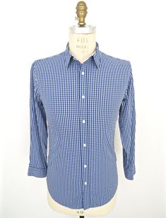 "\"Renaissance Man\" vintage dress shirt by DKNY in blue-on-light-blue check patterned 100% cotton--Beautiful condition! SIZE: Tagged Men's Small MEASUREMENTS*: Shoulder: 17\" Chest (underarm to underarm): 19\" Waist: 18\" Length (base of back collar to back hem): 29\" Sleeve (outside shoulder seam to sleeve): 23\" Neck: 15-15.5\" *All measurements taken seam-to-seam lying flat and should be doubled where applicable, i.e., chest, waist. Label: DKNY Jeans Color: Blue & Light Blue (Check) with Classic Fitted Plaid Shirt, Classic Plaid Fitted Shirt, Plaid Fitted Classic Shirt, Business Cotton Checkered Shirt, Blue Cotton Dress Shirt For Spring, Casual Blue Fitted Dress Shirt, Business Casual Gingham Cotton Shirt, Business Cotton Gingham Shirt, Fitted Cotton Dress Shirt For Summer