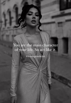 a woman in a dress standing on the street with a quote above her that reads, you are the main character of your life, so act like it