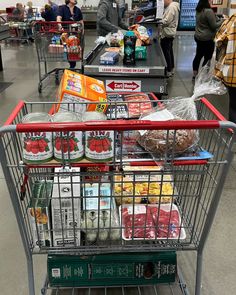 a shopping cart filled with food in a store