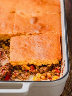 a casserole dish with meat and vegetables in it