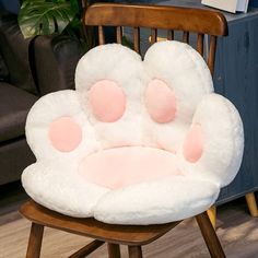 a chair with paw prints on it in a room