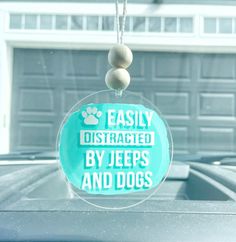 a clear ornament that says easily distracted by jeeps and dogs