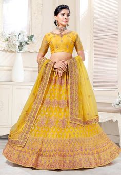 Yellow net wedding lehenga choli 136736  Desc:  Style : Circular Lehenga Choli Color : Yellow Fabric : Net Work : Embroidery Wash Care : Dry clean Sleeve Style : Half Sleeve Long Sleeves : Done only in Custom Stitch Sleeves Lining : Done only in Custom Stitch Bust Size : 32 to 42 Inches Occasion : Wedding   Bridal   Mehendi   Sangeet   Reception   Engagement. With Express Free Shipping and Custom Stitching, Buy Indian Wedding Party Wear Lehenga Yellow net wedding lehenga choli 136736 online in U Lehenga Choli Designs, Lehenga Choli Wedding, Yellow Lehenga, Party Wear Lehenga Choli, Net Blouses, Indian Bridal Lehenga, Saree Navel, Yellow Style, Net Lehenga