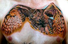 a man with an owl tattoo on his chest