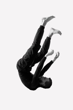 a man flying through the air while riding a skateboard in front of a white background