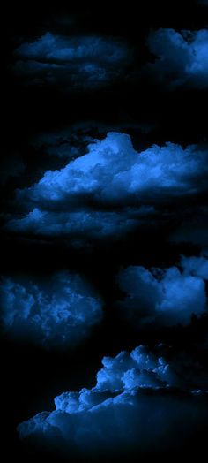 the sky is filled with dark clouds and blue hues on black background, as seen from above