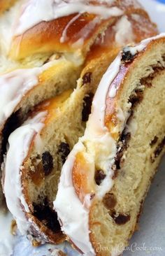 two slices of cinnamon roll with icing on top