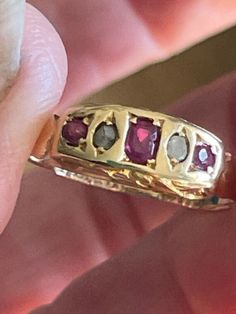 Lovely 18k gold Natural & Genuine Ruby & Diamond ring  The ring is approximately a size 6 but can be easily sized.  Classic in design with side detailing (a bit worn- see photos) Many hallmarks on the inside...see photos. Hallmarks indicate Birmingham 1907 Hallmarked 18=18k gold...tested as such The center ruby measures approximately 3.5x 2.75mm  2 side rubies: 2.5mm There are a total of 2 diamonds somewhat crudely cut approx. 2.25 mm each for accents The rubies are a beautiful fuschia red color Victorian 14k Gold Diamond Cut Rings, Victorian Multi-stone Yellow Gold Rings, Antique Multi-stone Yellow Gold Cluster Ring, Antique Multi-stone Cluster Ring In Yellow Gold, Victorian Gold Cluster Ring With Gemstone, Victorian Multi-stone Yellow Gold Diamond Ring, Antique Multi-stone Gold Diamond Ring, Heirloom Yellow Gold Ruby Signet Ring, Heirloom Ruby Signet Ring In Yellow Gold