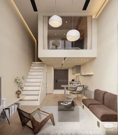 a living room filled with furniture next to a staircase