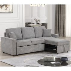 a living room with a sectional couch and coffee table