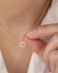 "Add a touch of elegance to your wardrobe with our exquisite 14k gold Tiny Diamond Heart Necklace. This stunning piece features a delicate heart pendant adorned with 18 sparkling diamonds. Perfect for any occasion, the fine gold chain and pendant create a timeless accessory. Treat yourself or a loved one to the allure and sophistication of this brilliant treasure. 14k gold Necklace Length: 16-18\" 8mm / 18 Genuine Diamonds" Fine Jewelry 14k Gold Heart Necklace For Mother's Day, Delicate 14k Gold Open Heart Jewelry, Delicate 14k Gold Necklace For Valentine's Day, Dainty Diamond Heart Charm Necklace, Delicate Open Heart 14k Gold Jewelry, Dainty Heart Necklace With Diamond Accents, Elegant White Gold Heart Necklace With Delicate Chain, Elegant Rose Gold Jewelry With Heart Detail, Mother's Day 14k Gold Heart Necklace