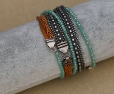 "This wrap bracelet features a lovely mix of crystal, silver beads and braided leather bracelet. A versatile wrap bead bracelet that can be easily worn with other accessories, especially boho ones. Different shades and different elements will make for a super cool gift for any woman who likes fashionable boho-chic jewelry. Product details: --------------------- Materials: *Leather *Turquoise crystal chez rondelle beads *silver-plated brass chain Measurements: *The bracelet length is 39.3\" / 1 m Bohemian Braided Bracelets With Silver Beads, Bohemian Multi-strand Beaded Bracelets With Silver Beads, Bohemian Silver Wrap Bracelet With Faceted Beads, Bohemian Multi-strand Silver Beaded Bracelets, Silver Bohemian Multi-strand Wrap Bracelet, Silver Beaded Bohemian Wrap Bracelet, Handmade Silver Multi-strand Wrap Bracelet, Bohemian Silver Hand Wrapped Braided Bracelets, Silver Bohemian Braided Bracelet With Beads