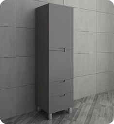 a tall gray cabinet sitting in front of a wall with grey tiles on it's sides