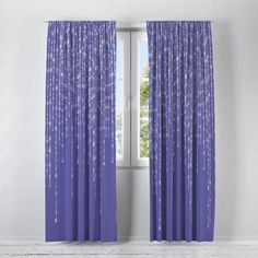 purple curtains with silver stars on them in front of a white wall and windowsill