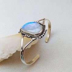 925 Sterling Silver Handmade Cuff Bracelet Gemstone - Blue Flashy Rainbow Moonstone Stone Shape - Fancy Colour - White Colour with Blue/Rainbow Fire Cut - Plain Cabochon Gemstone Size - 27*17 mm QTY - 1 piece. # Please send us your message in conversation if you have any questions or need more quantity of any particular item . Bohemian Sterling Silver Bangle With Gemstone, Silver Cuff Bracelet Fine Jewelry For Gift, Spiritual Moonstone Bangle Jewelry, Spiritual Moonstone Bangle, Silver Sterling Silver Cuff Bracelet With Cabochon, Silver Moonstone Bangle, Silver Cabochon Cuff Bracelet Gift, Fine Jewelry Cabochon Bracelets As Gift, Spiritual Moonstone Cuff Bracelet As Gift