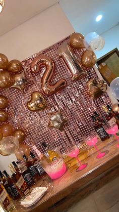 the table is decorated with balloons and decorations